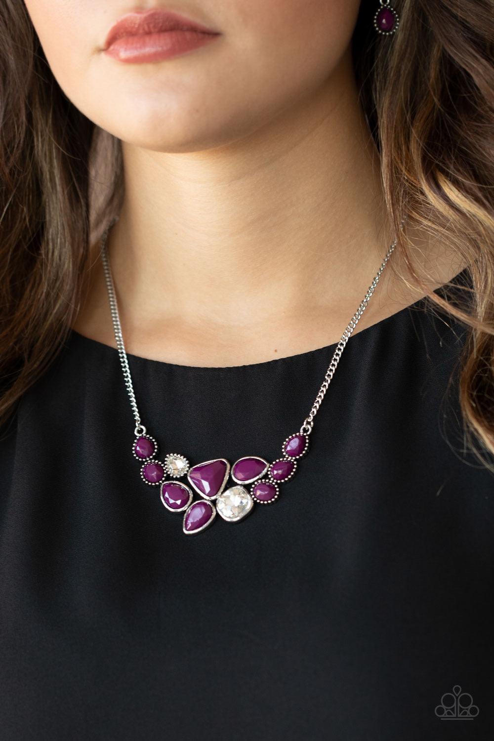 Paparazzi Accessories Breathtaking Brilliance - Purple Featuring smooth and studded silver frames, a collection of teardrop, oval, and triangular plum beads coalesce with matching white rhinestones below the collar for a glamorous pop of collar. Features