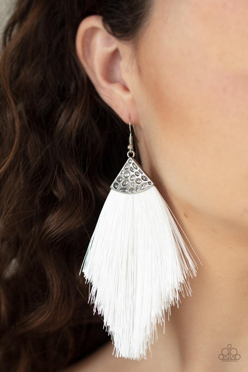 Paparazzi Accessories Tassel Tempo - White Shiny white thread fans out from the bottom of a hammered silver fitting, creating a tapered fringe. Earring attaches to a standard fishhook fitting. Sold as one pair of earrings. Jewelry