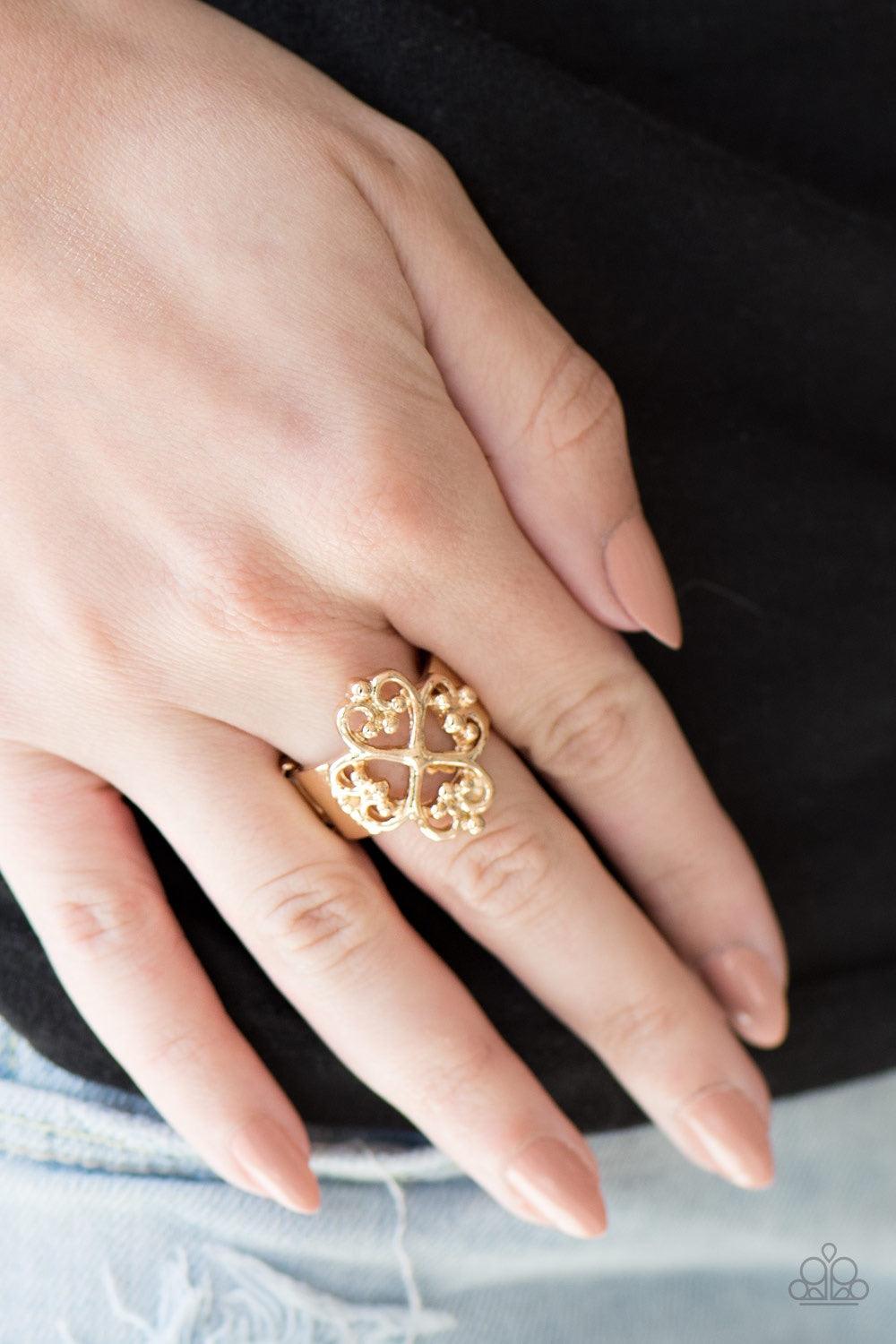 Paparazzi Accessories Street-REGAL - Gold Brushed in a high-matte sheen, glistening gold bars swirl atop the finger, creating a regal filigree filled frame. Features a stretchy band for a flexible fit. Jewelry