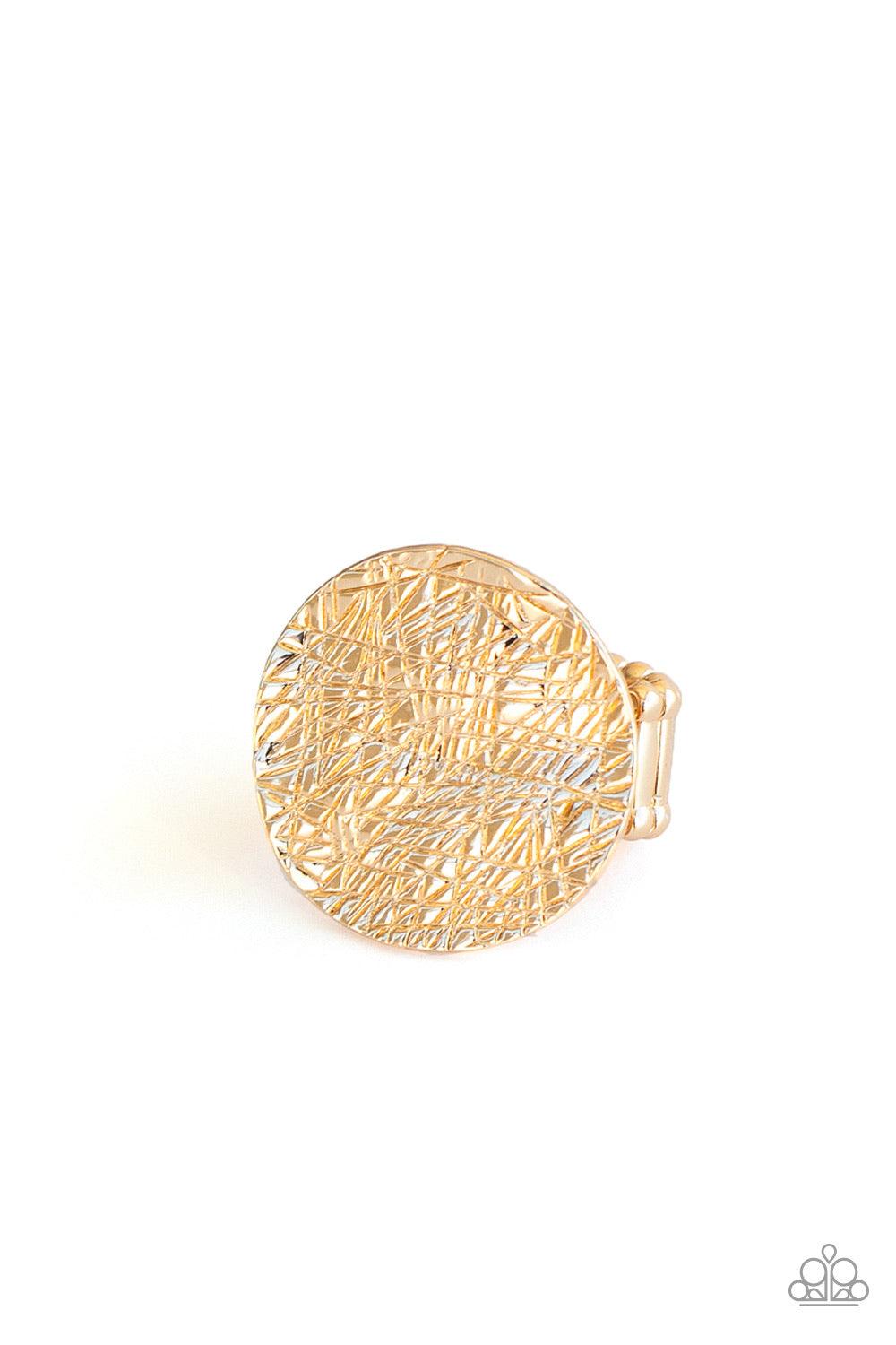Paparazzi Accessories Lined Up - Gold An oversized gold disc is etched in crisscrossing textures and hammered into light-catching ripples as it sits atop the finger unapologetically. Features a stretchy band for a flexible fit. Sold as one individual ring