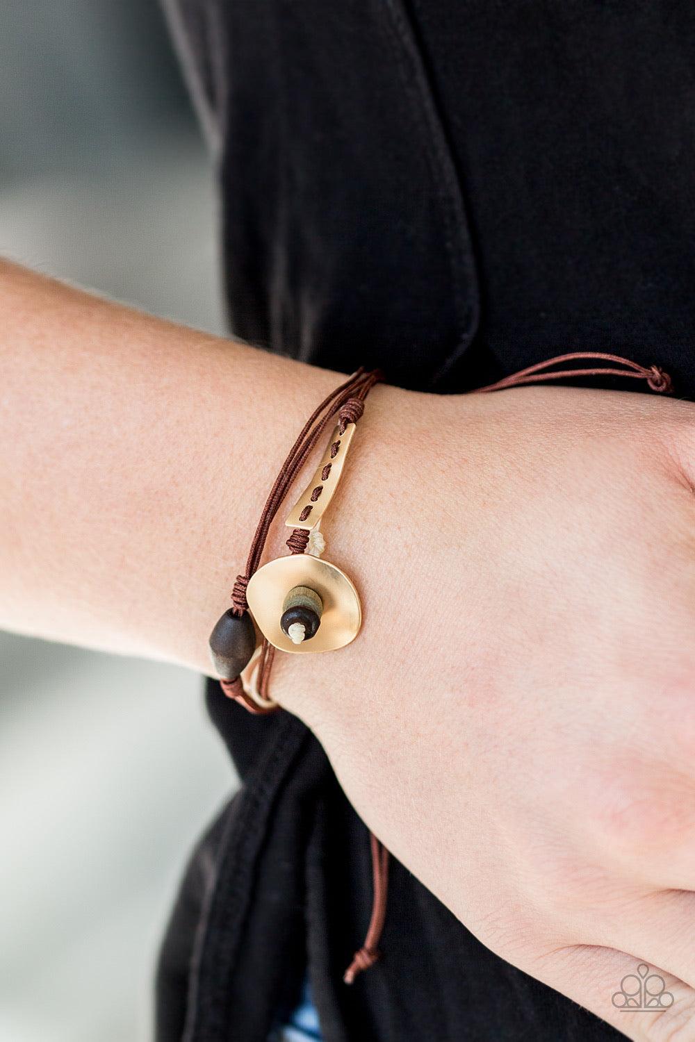 Paparazzi Accessories Trail Trek - Brown Layers of brown and white cording knot around abstract metallic plates and earthy wooden beads for a seasonal look. Features an adjustable sliding knot closure. Sold as one individual bracelet. Jewelry