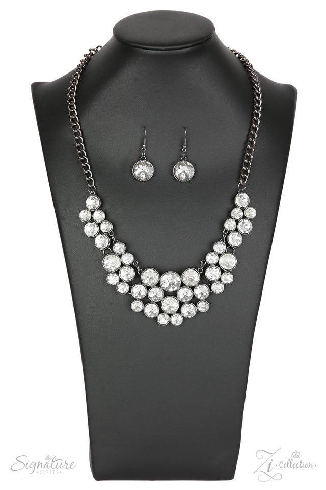 Paparazzi Accessories The Angela Oversized white rhinestones are pressed into studded gunmetal frames, creating a gorgeous collision of glamour and edge. The glittery gems are grouped in small clusters as they swing from a gunmetal chain, resulting in a f