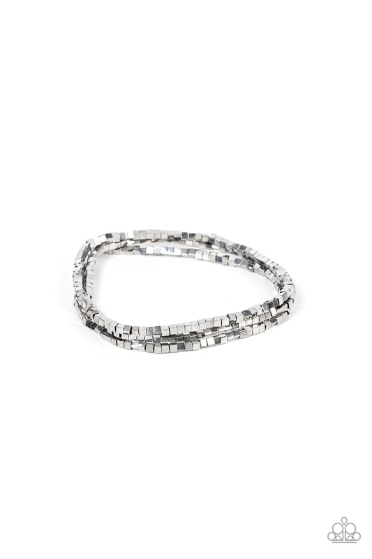Paparazzi Accessories Block Bash - Silver A dainty collection of silver cube beads alternates along stretchy bands, stacking into edgy layers around the wrist. Sold as one set of three bracelets. Jewelry
