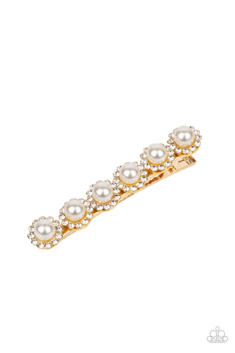 Paparazzi Accessories Polished Posh - Gold Bordered in rings of dainty white rhinestones, pearly white beads embellish the front of a gold hair clip for a timeless finish. Sold as one individual hair clip. Hair Claws & Clips