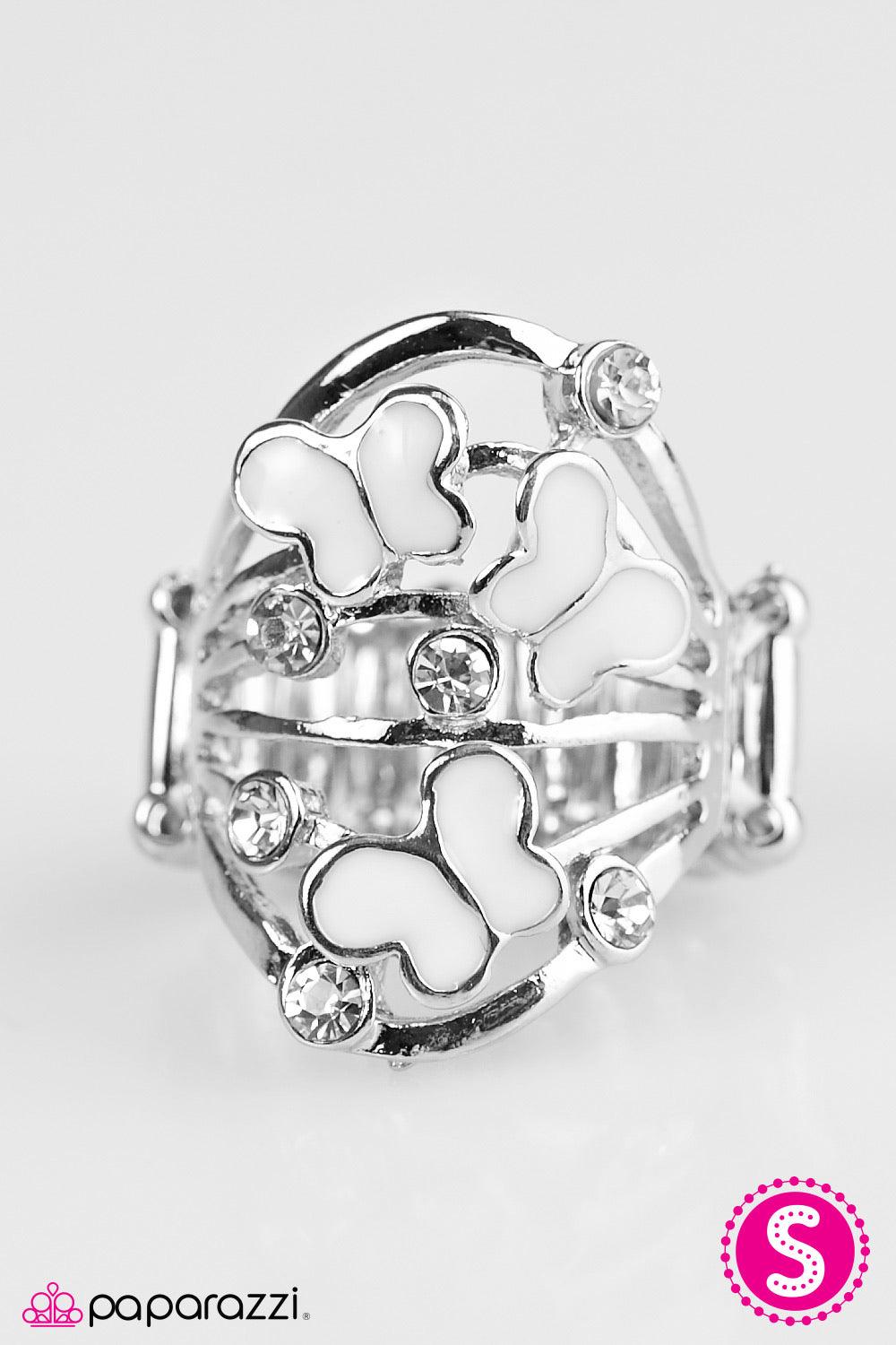 Paparazzi Accessories Butterfly Botanical - White Dainty white butterflies dance across the finger. Dazzling white rhinestones are sprinkled across the arcing silver bands, adding a sparkling finish to the whimsical palette. Jewelry