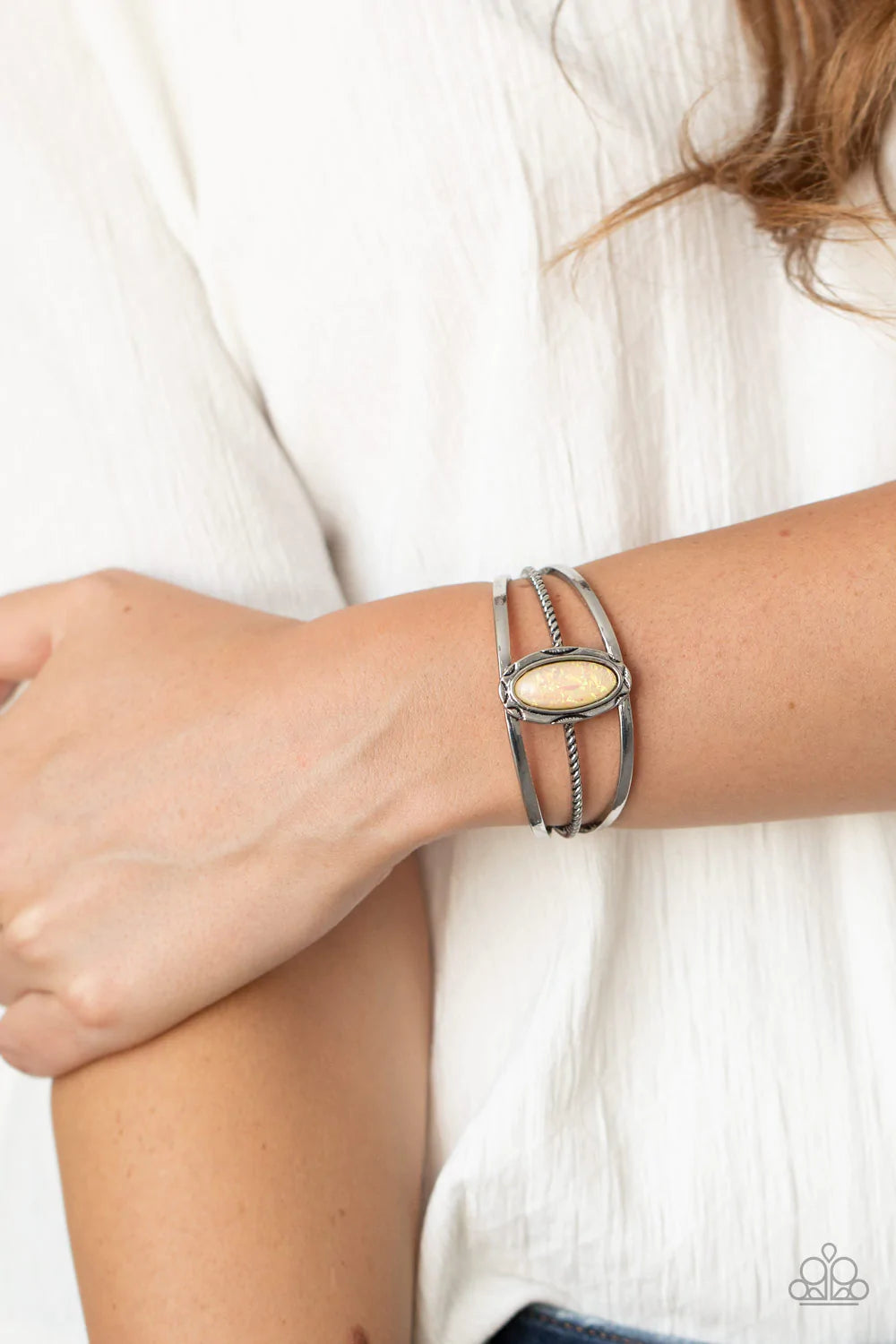 Paparazzi Accessories Stone Sahara - Yellow A glittery yellow stone is pressed into a decorative silver frame atop a mismatched layered cuff, creating a seasonal sparkle around the wrist. Sold as one individual bracelet. Jewelry