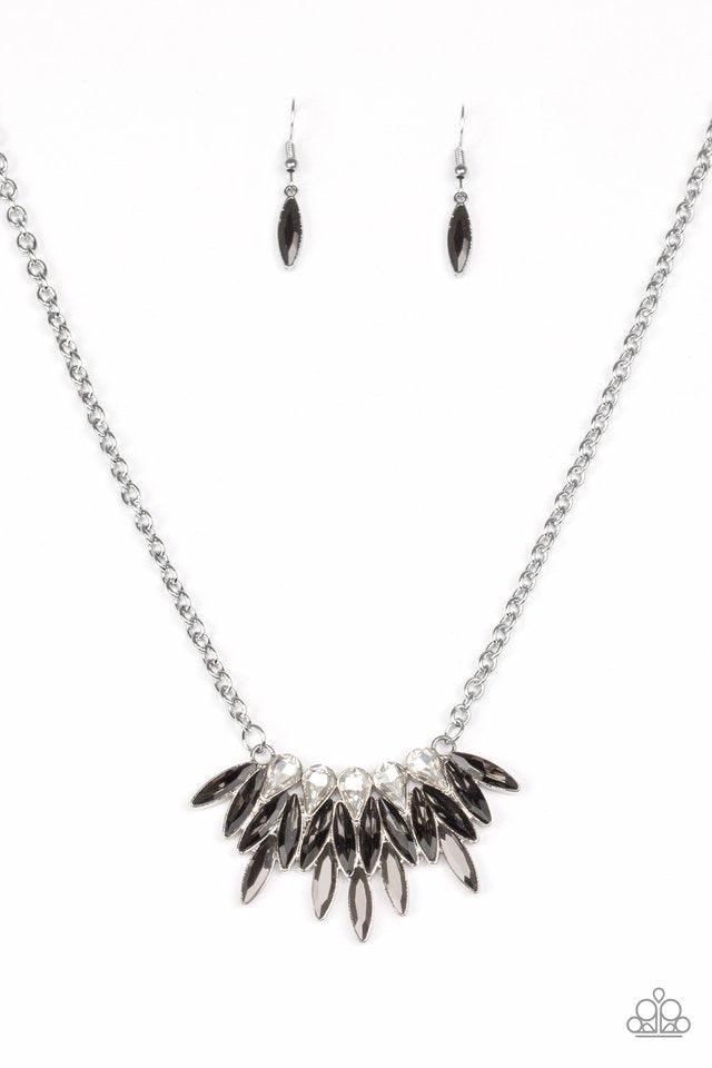 Paparazzi Accessories Crown Couture - Silver Featuring regal teardrop and marquise style cuts, glittery white, smoky gray, and glassy hematite rhinestones fan below the collar for a dramatic look. Features an adjustable clasp closure. Sold as one individu