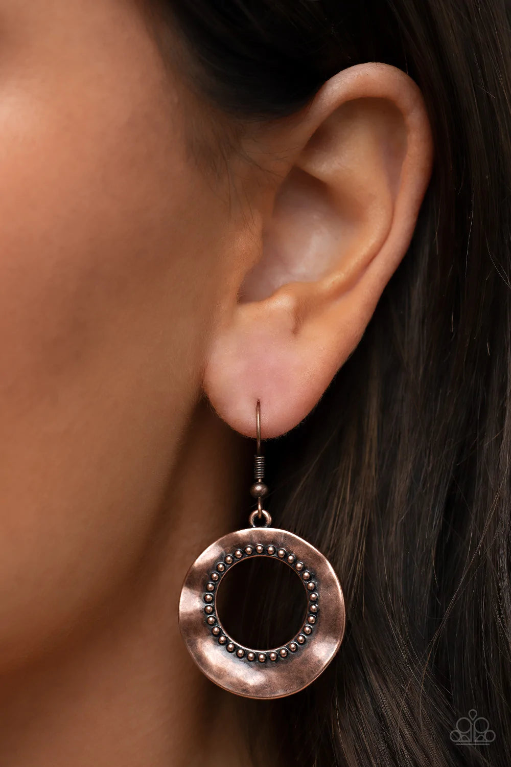 Paparazzi Accessories Desert Diversity - Copper Brushed in a burnished finish, a warped copper disc ripples around a studded copper center for a rustic flair. Earring attaches to a standard fishhook fitting. Sold as one pair of earrings.