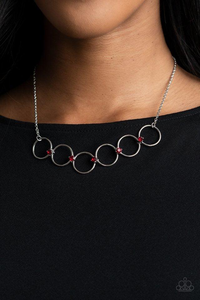 Paparazzi Accessories Regal Society - Red Fiery red rhinestones link a dainty row of silver rings below the collar, creating a regal minimalist inspired display. Features an adjustable clasp closure. Sold as one individual necklace. Includes one pair of m