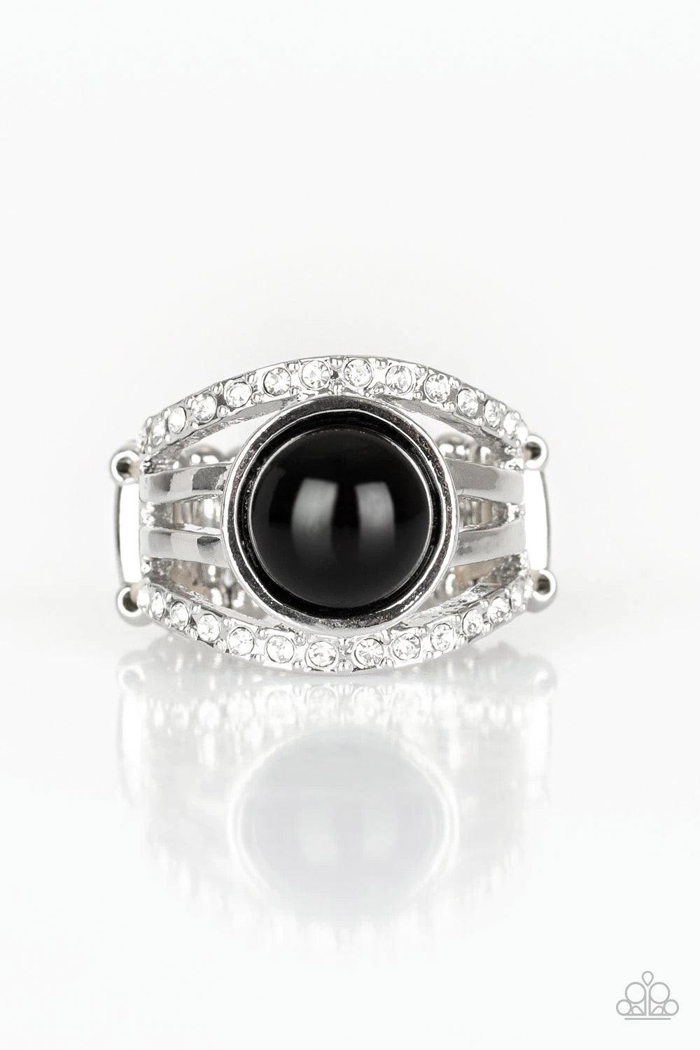 Paparazzi Accessories A Big Break - Black Radiating with glassy white rhinestones, row after row of glittering silver bars arc across the finger. A shiny black bead is pressed into the center of the layered bands, adding a dramatically refined finish to t