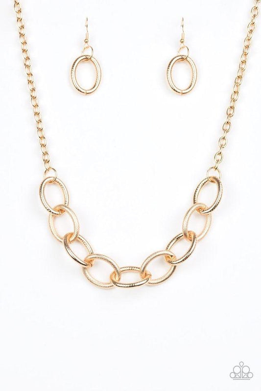 Paparazzi Accessories Boldly Bronx - Gold Featuring mismatched textures, bold gold links connect below the collar for a dramatic industrial look. Features an adjustable clasp closure. Sold as one individual necklace. Includes one pair of matching earrings