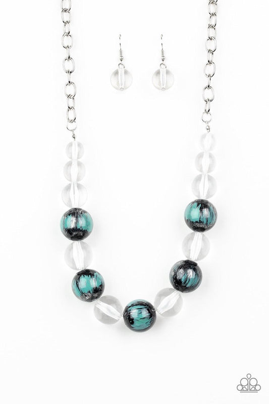 Paparazzi Accessories Torrid Tide - Blue A collection of shiny black and glassy clear beads are threaded along an invisible wire below the collar. The black beads are splashed in hints of refreshing blue and shiny metallic paint for a colorful finish. Fea