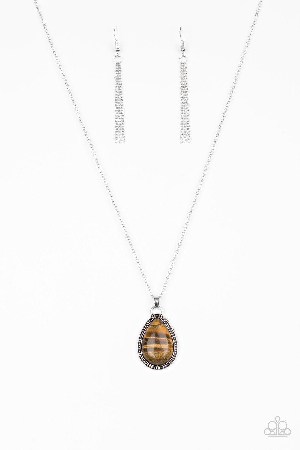 Paparazzi Accessories On The Home FRONTIER - Brown A teardrop tiger's eye stone is pressed into a studded silver frame, creating a tranquil pendant below the collar. Features an adjustable clasp closure. Jewelry
