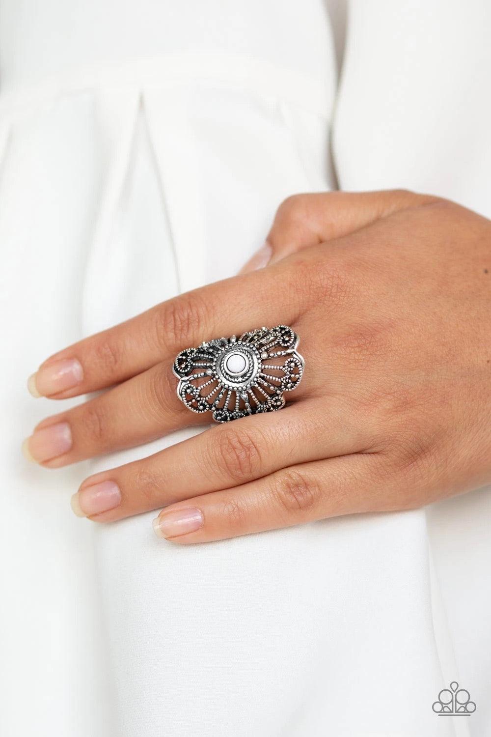 Paparazzi Accessories Adrift ~White A dainty white bead is pressed into a round silver frame swirling with studded details for a whimsical vibe. Features a stretchy band for a flexible fit. Sold as one individual ring. Jewelry