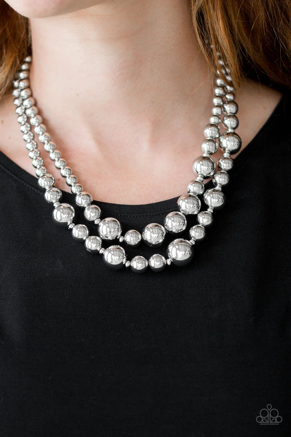 Paparazzi Accessories I Double Dare You - Silver Gradually increasing in size near the center, strands of glistening silver beads are threaded along invisible wires below the collar for a daring look. Features an adjustable clasp closure. Sold as one indi