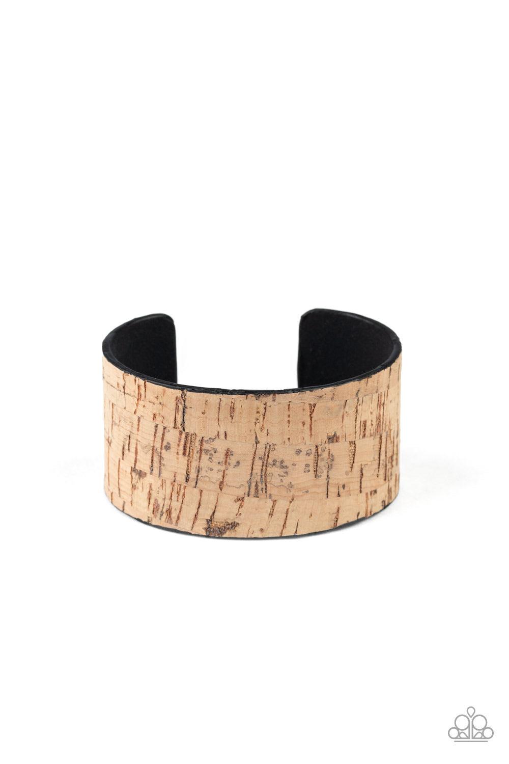 Paparazzi Accessories Cork Couture - Brown Featuring a cork-like finish, a thick cuff wraps around the wrist for a seasonal flair. Jewelry