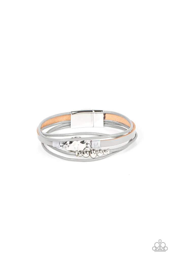 Paparazzi Accessories Tahoe Tourist - Silver Infused with a silver beaded accent, rows of shiny Ultimate Gray cording join an Ultimate Gray leather band around the wrist. A hammered silver teardrop is knotted in place with Ultimate Gray thread, adding an