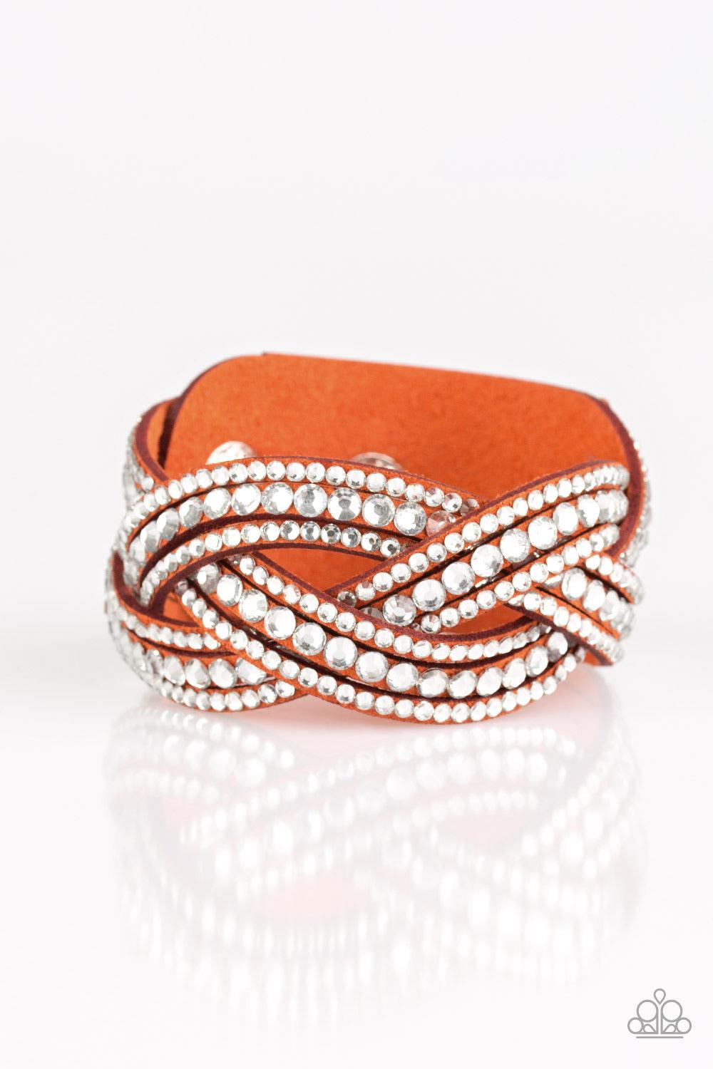 Paparazzi Accessories Bring on the Bling - Orange Varying in size, glassy white rhinestones are encrusted along interwoven orange suede bands, creating blinding shimmer across the wrist. Features an adjustable snap closure. Sold as one individual bracelet