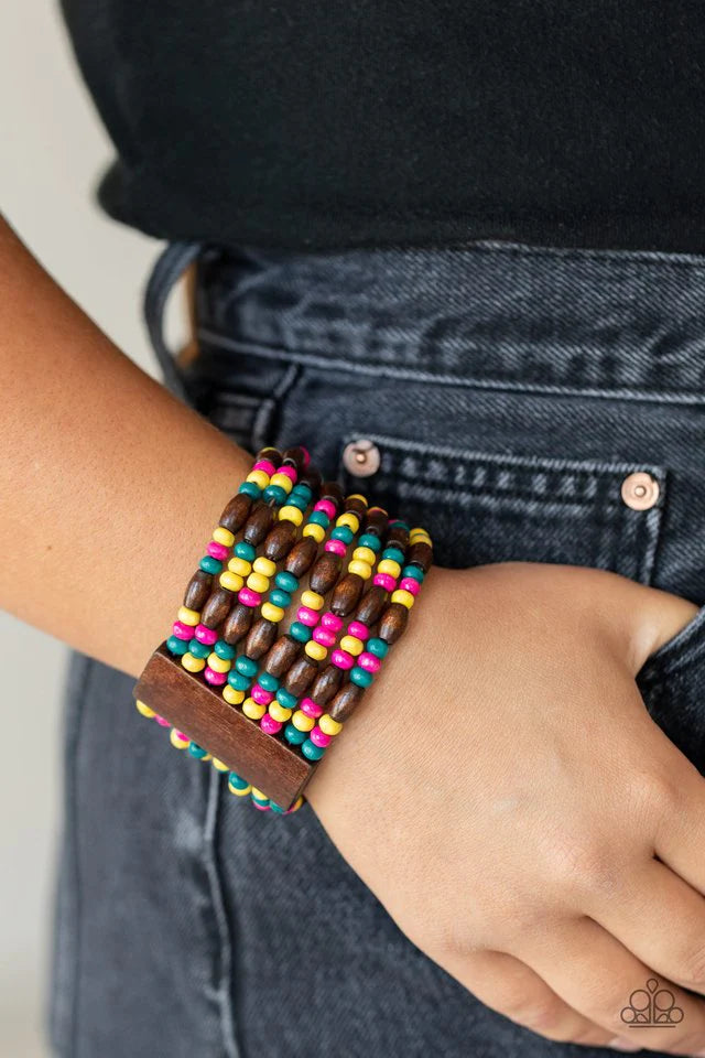 Paparazzi Accessories Tropical Nirvana - Multi Held together with brown wooden rectangular frames, mismatched rows of oval brown and round multicolored wooden beads are threaded along stretchy bands around the wrist for a whimsically layered look.