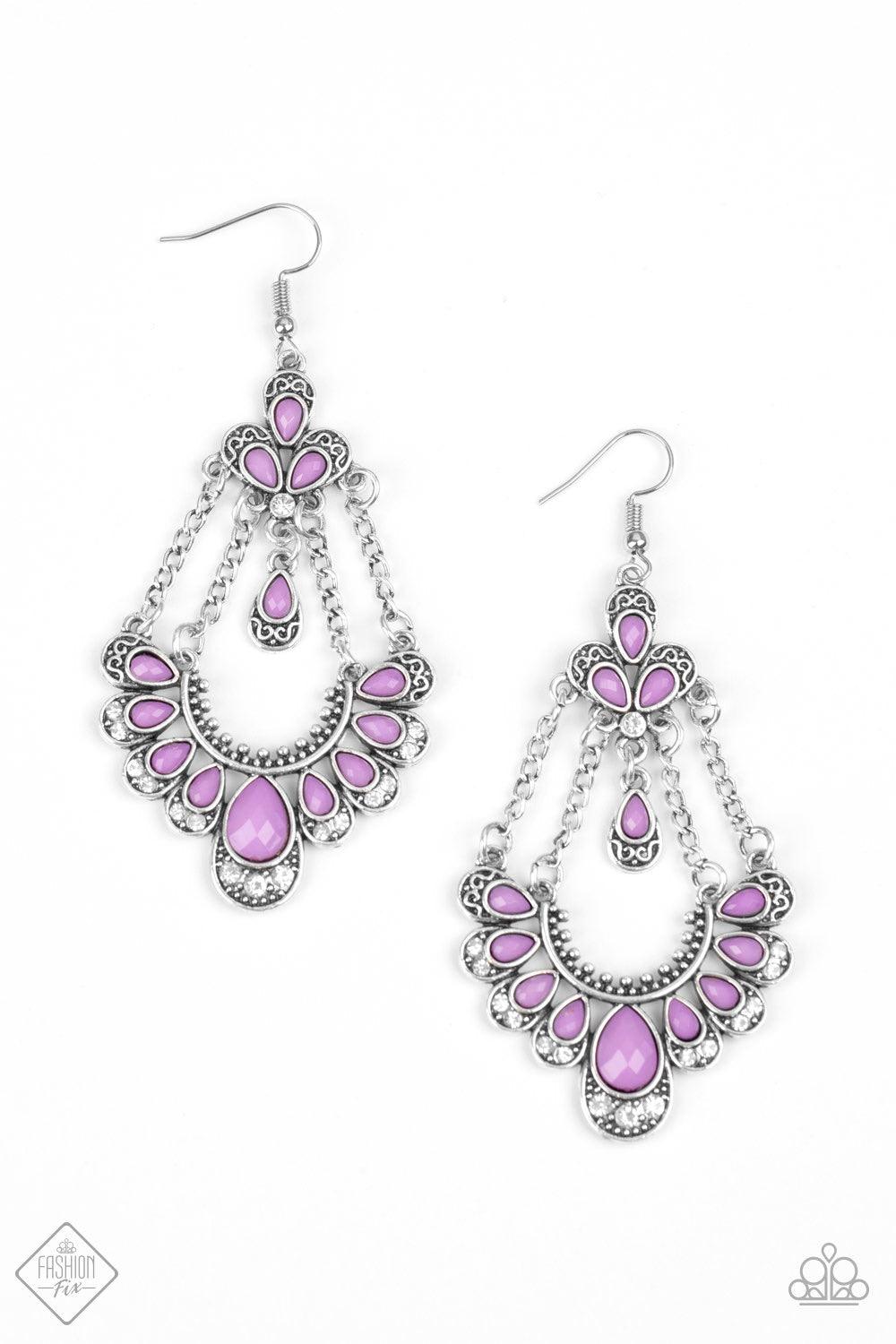 Paparazzi Accessories Unique Chic ~Purple Faceted purple teardrop-shaped beads are pressed into silver fittings decorated in filigree and texture. The beads fan out along the bottom of a curved silver bar that is suspended from strands of silver chain. A