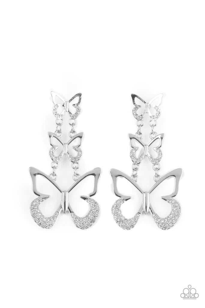 Paparazzi Accessories Flamboyant Flutter - Silver An airy trio of silver butterflies gradually increase in size as they link into a whimsical lure. The bottom of each butterfly has been dipped in white rhinestones, adding a glitzy finish to the fluttering