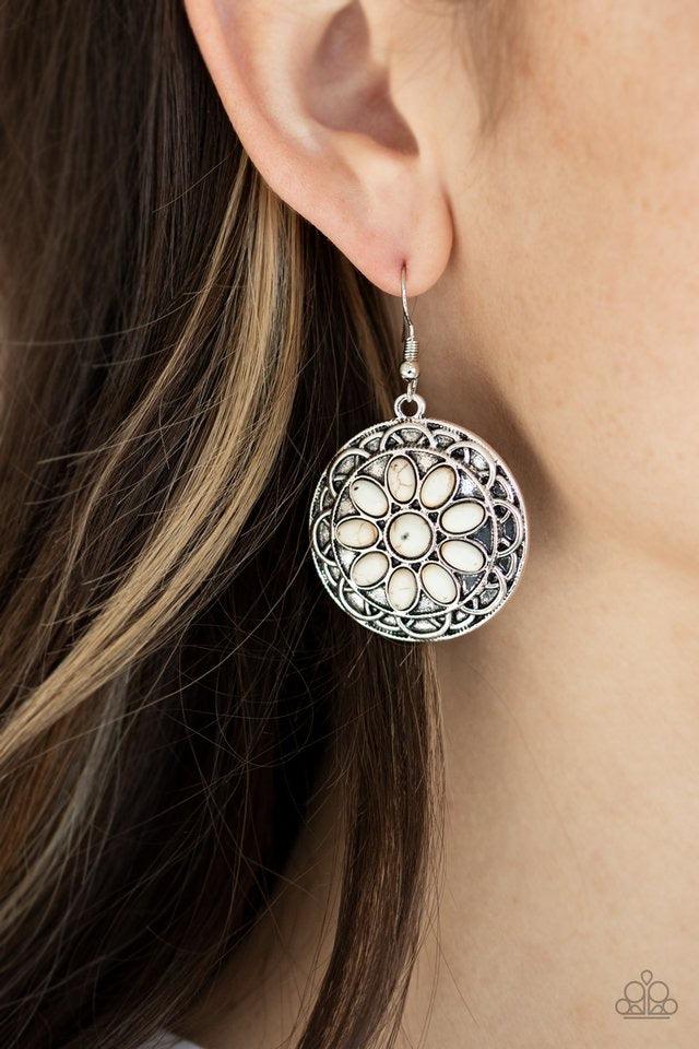 Paparazzi Accessories Mesa Oasis - White Refreshing white stones are pressed into the center of an ornate silver frame, creating a whimsical flower. Earring attaches to a standard fishhook fitting. Sold as one pair of earrings. Jewelry