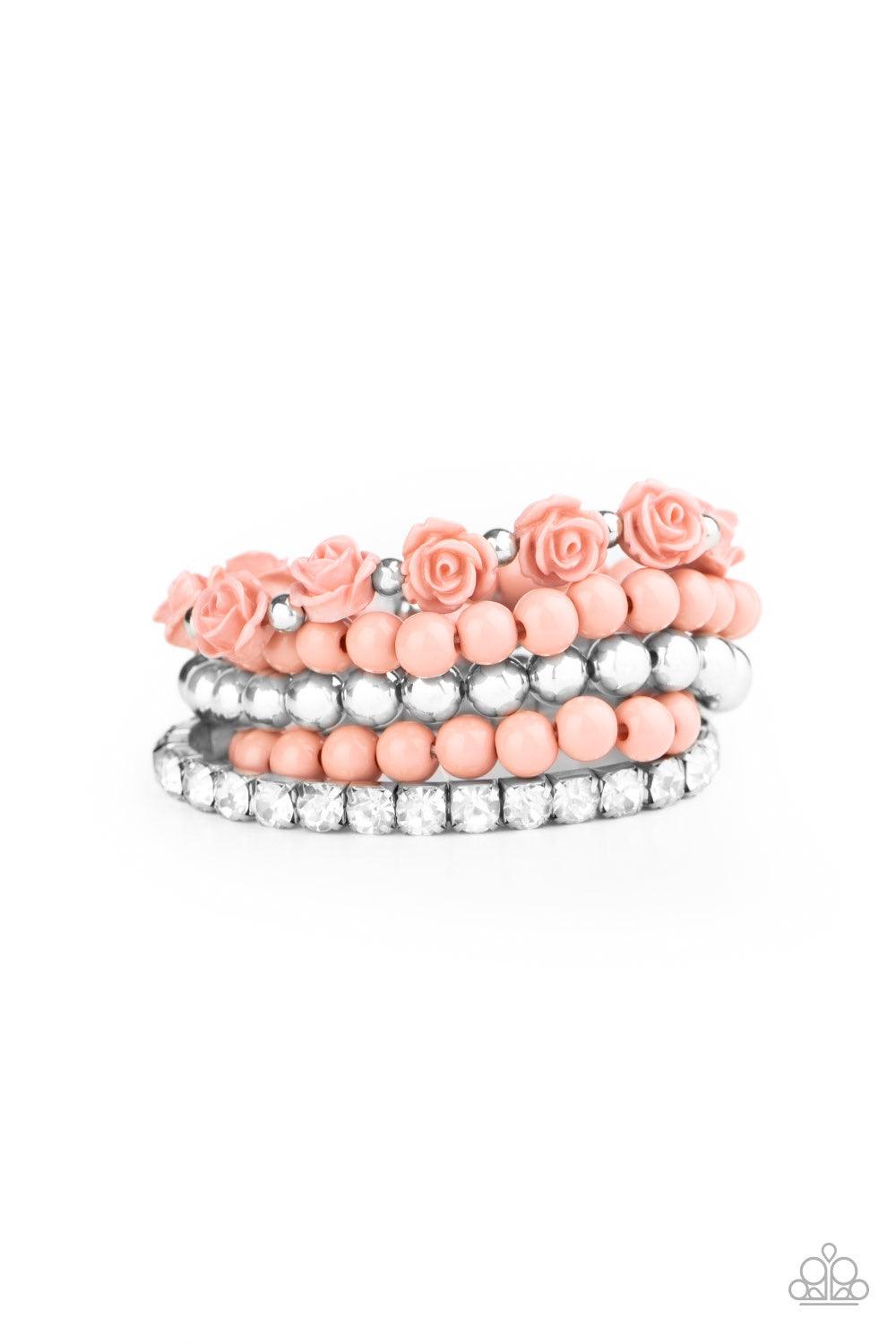 Paparazzi Accessories Rose Garden Grandeur - Pink Featuring a dusky hue, a vintage inspired collection of Rose Tan resin roses and beads joins stretchy bands of silver beaded and glittery white rhinestone dotted bracelets around the wrist for a flawlessly