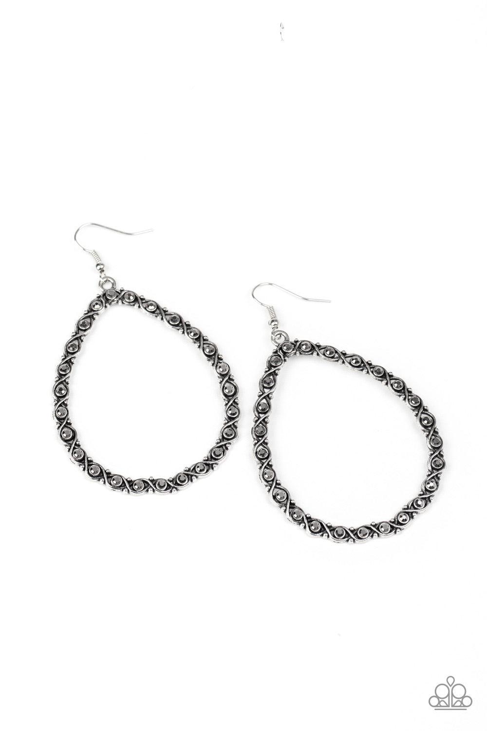 Paparazzi Accessories Galaxy Gardens - Silver Antiqued silver bars delicately twist around smoky hematite rhinestones, coalescing into a bedazzling teardrop lure. Earring attaches to a standard fishhook fitting. Jewelry