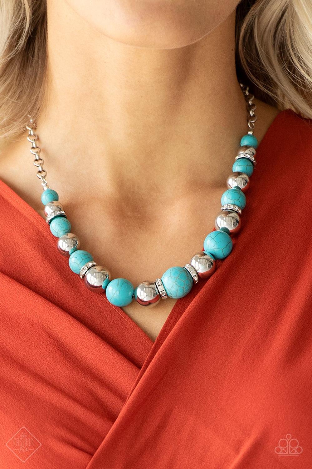 Paparazzi Accessories The Ruling Class - Blue A strand of faux turquoise stones, shiny silver beads, and white rhinestone-encrusted rings falls below the collar in a refined fashion. Features an adjustable clasp closure. Jewelry