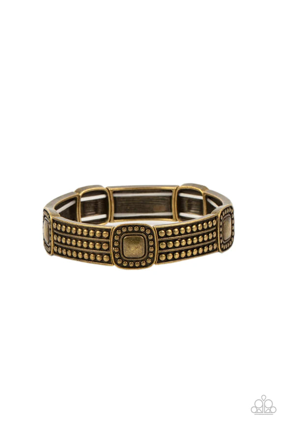 Paparazzi Accessories Rustic Redux - Brass Featuring brass studded patterns, square and rectangular frames are threaded along stretchy bands around the wrist for a rustic flair. Sold as one individual bracelet. Bracelets
