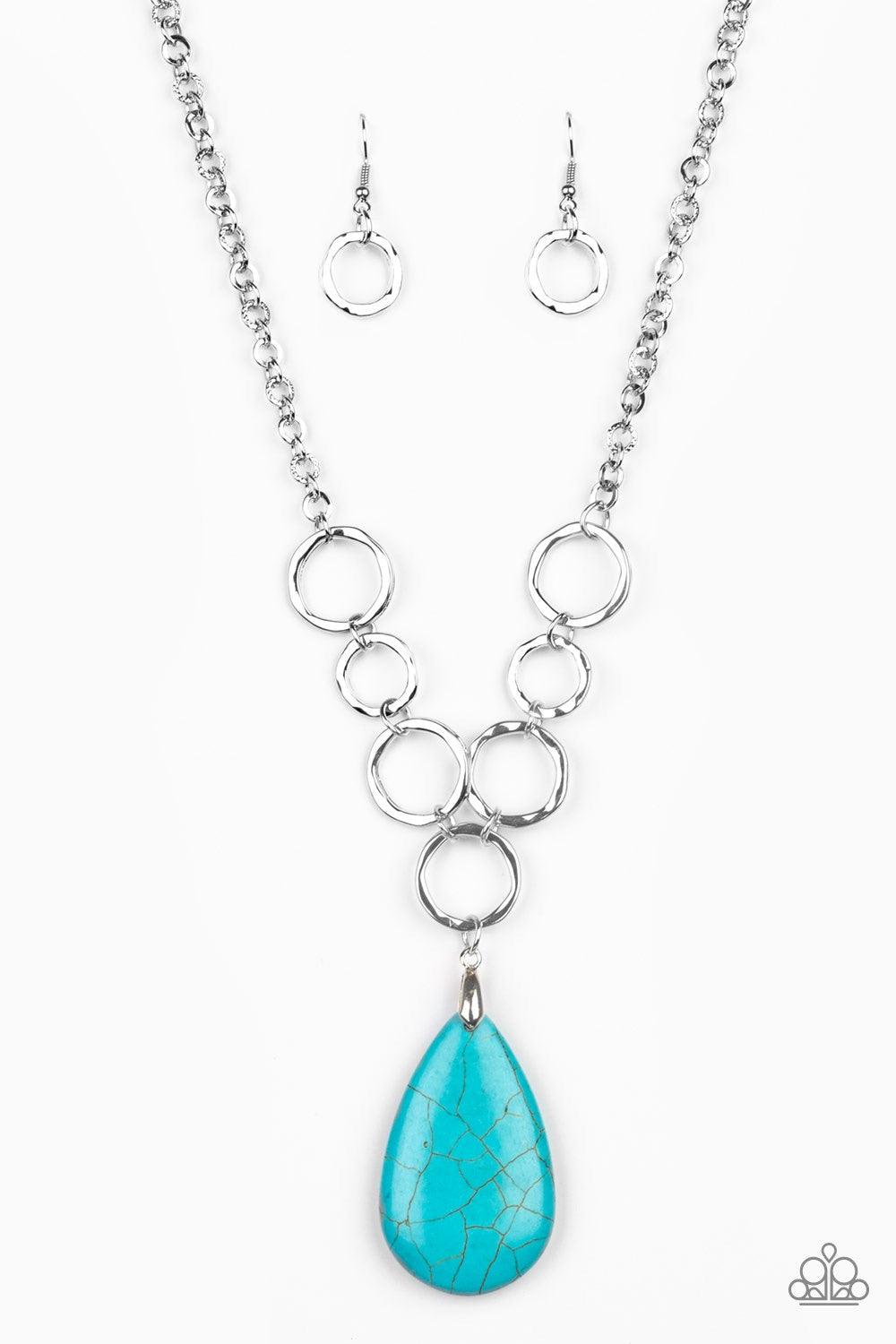Paparazzi Accessories Livin on A Prairie - Blue A collection of silver links give way to a refreshing turquoise stone teardrop, creating a tranquil pendant below the collar. Each silver ring is hammered in texture, adding an artisanal touch to the piece.