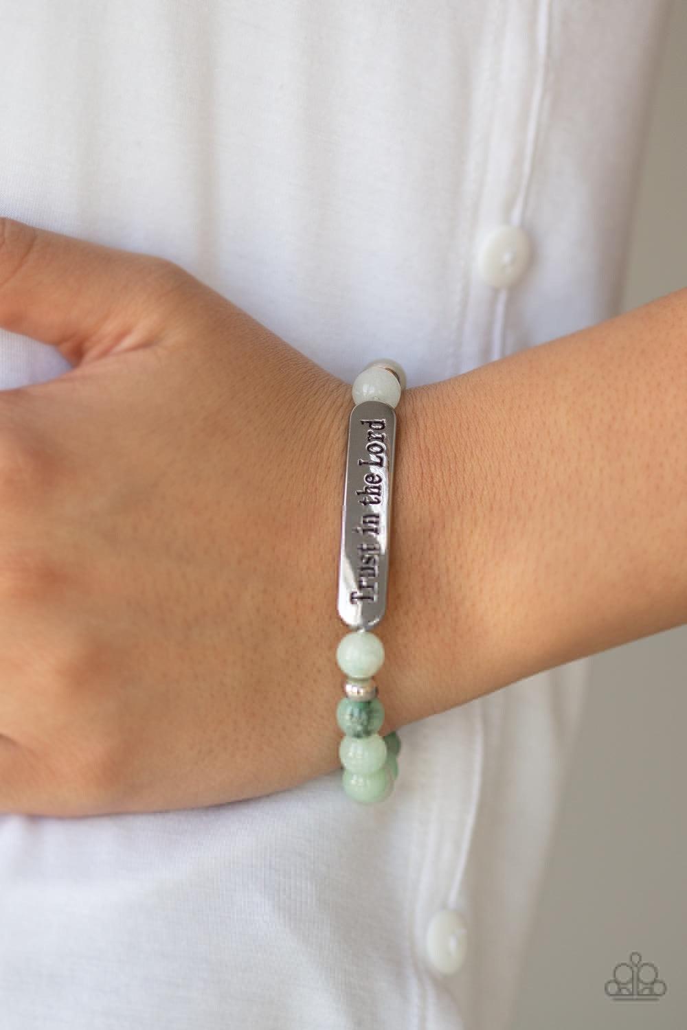 Paparazzi Accessories Trust Always - Green Infused with dainty silver accents, a collection of glassy stone beads and a shimmery silver frame stamped in the phrase, "Trust in the Lord", are threaded along a stretchy band around the wrist for an inspiratio