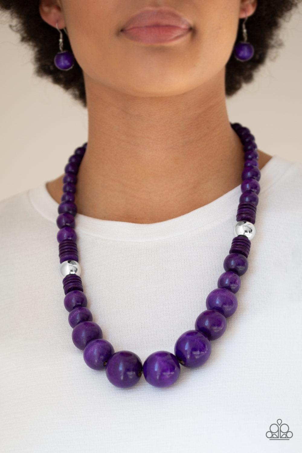 Paparazzi Accessories Panama Panorama - Purple Infused with dramatic silver beads, an array of vivacious purple wooden beads drape across the chest for a summery look. Features a button-loop closure. Jewelry