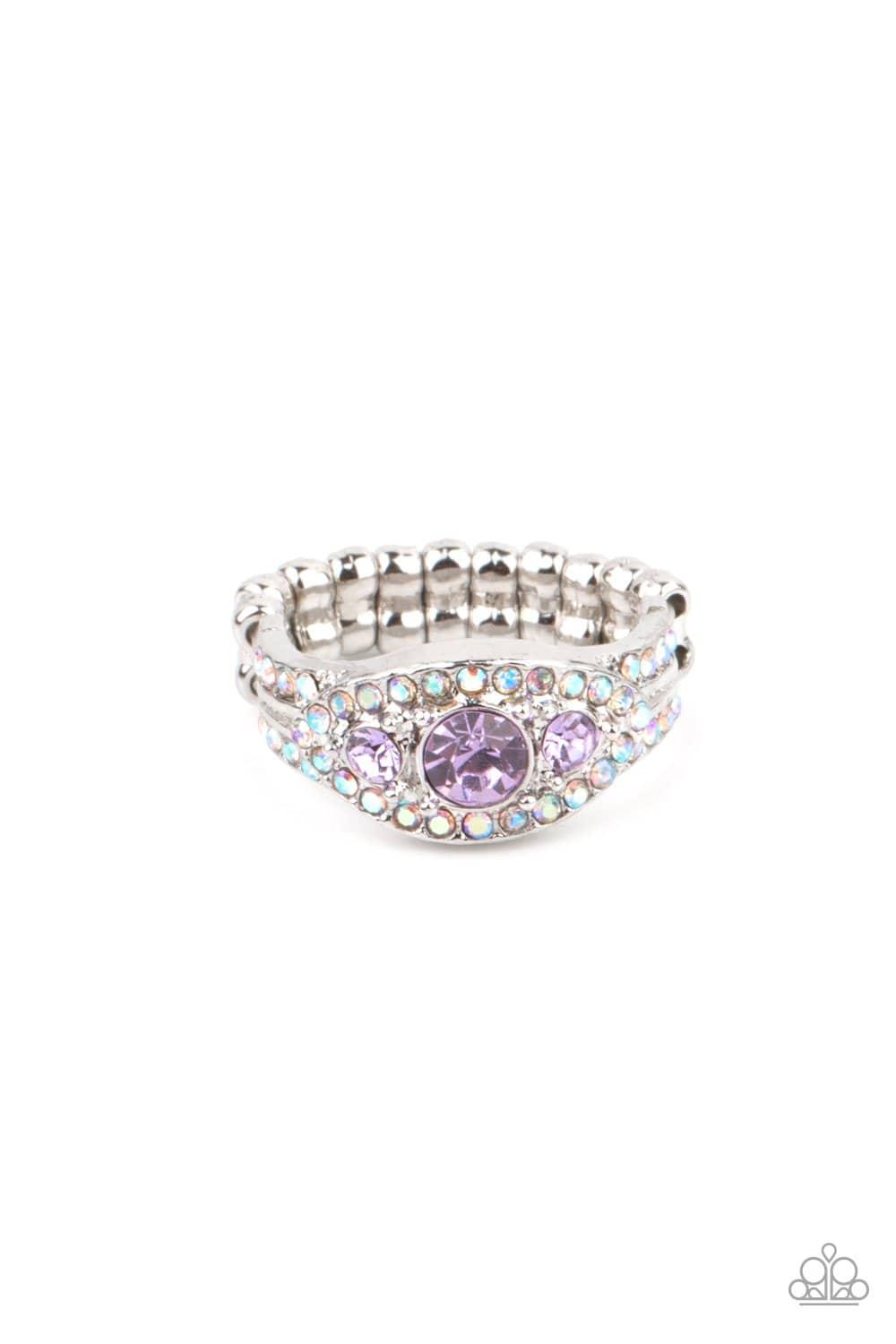 Paparazzi Accessories Celestial Crowns - Purple A trio of brilliant Amethyst Orchid rhinestones are set inside a glittering rhinestone encrusted frame creating a divinely heavenly essence atop the finger. Features a dainty stretchy band for a flexible fit