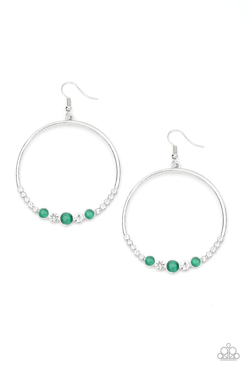 Paparazzi Accessories Dancing Radiance - Green A collection of glittery white rhinestones and glowing green cat's eye stones are encrusted along the bottom of a glistening silver hoop for a refined look. Earring attaches to a standard fishhook fitting. So