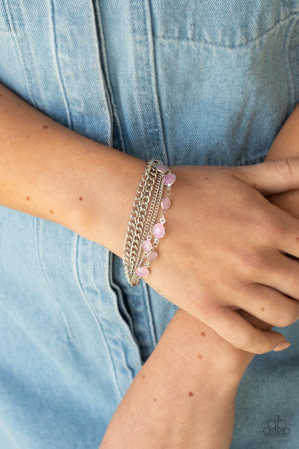 Paparazzi Accessories Glossy Goddess - Pink Infused with glassy Pale Rosette beaded strands, layers of mismatched silver chains drape around the wrist for an ethereal pop of color. Features an adjustable clasp closure. Sold as one individual bracelet. Jew