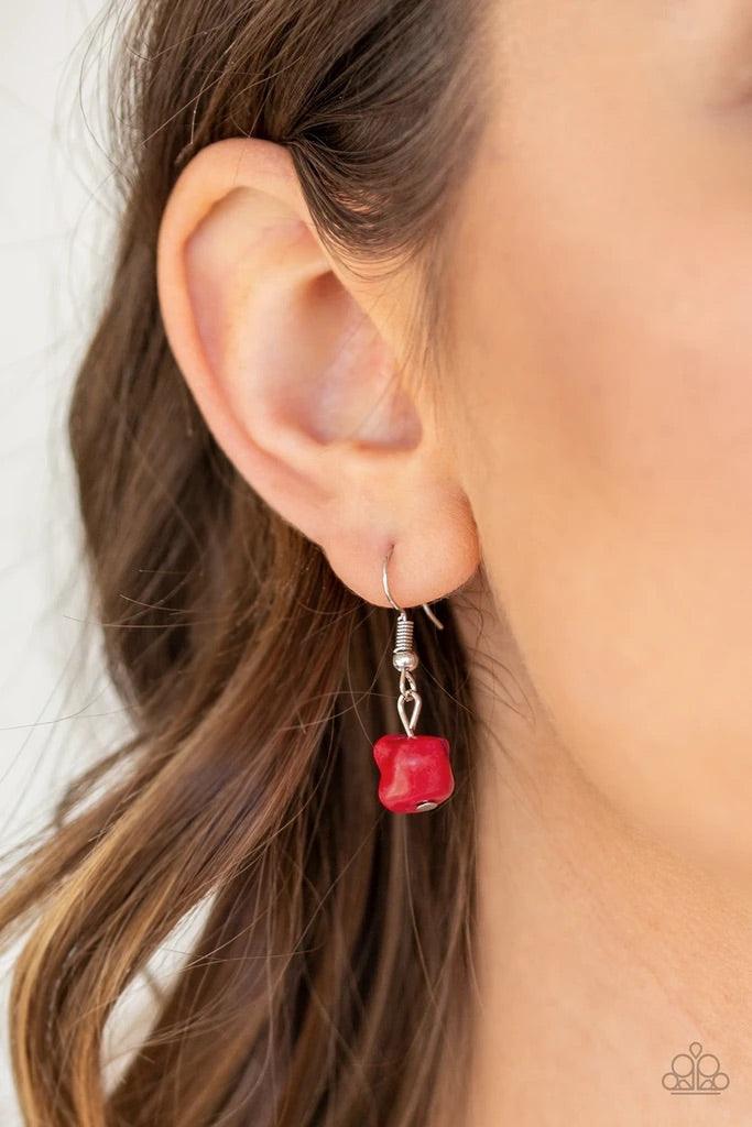 Paparazzi Accessories Wild Horse Wonder - Red Infused with a lengthened silver chain, a shimmery silver tassel swings from the bottom of a stacked red stone and hammered silver frame for a seasonal look. Features an adjustable clasp closure. Sold as one i