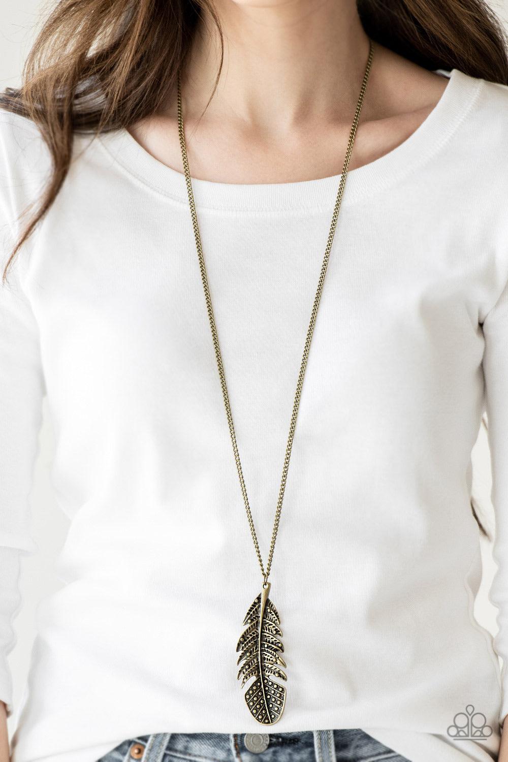 Paparazzi Accessories Free Bird - Brass Featuring studded and antiqued textures, a dramatic brass feather pendant swings from the bottom of an elongated brass chain for a free-spirited fashion. Features an adjustable clasp closure. Jewelry