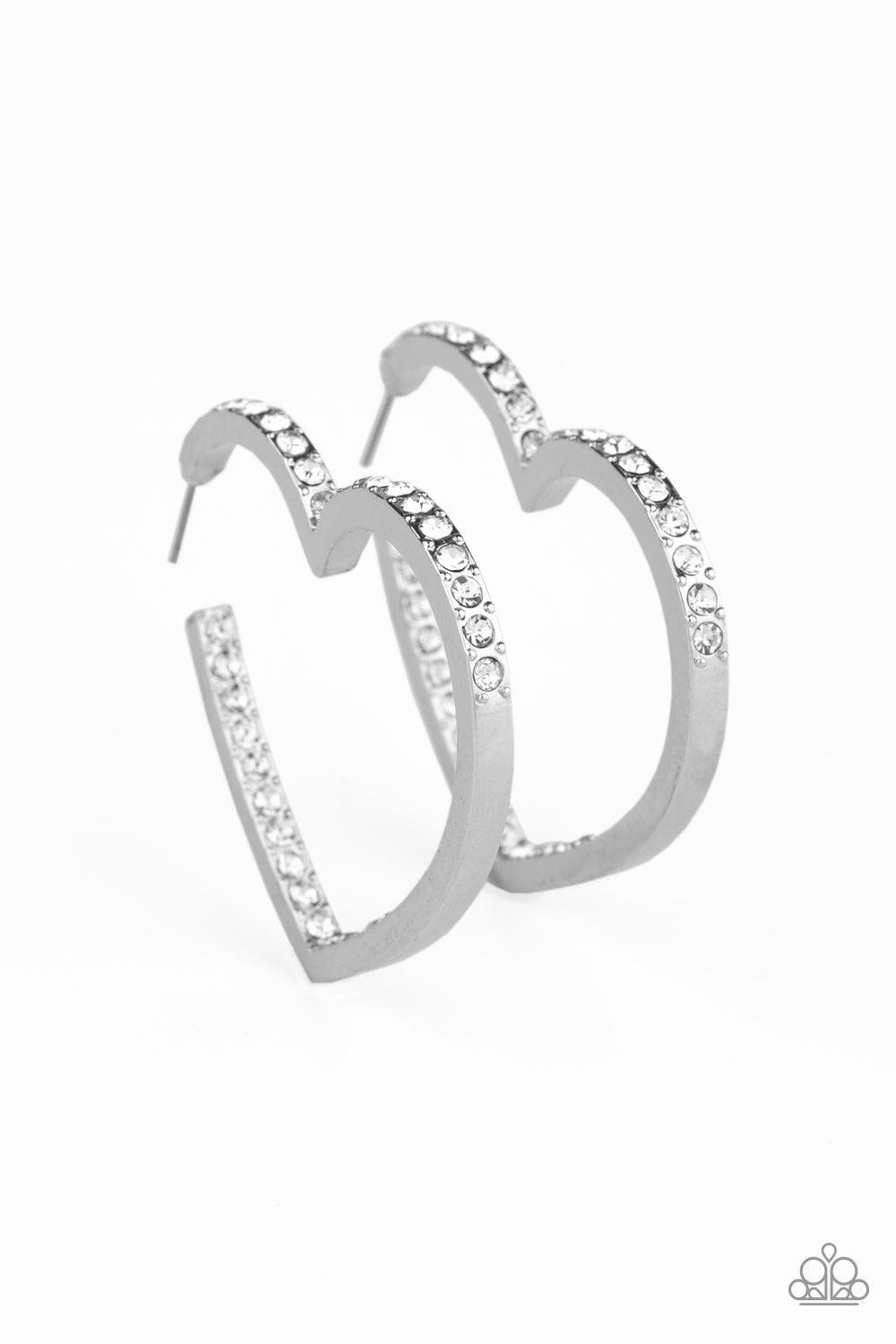 Paparazzi Accessories Heartbreaker - White Encrusted in sections of glittery white rhinestones, a glistening silver hoop curls into a charming heart shape for a heart-stopping look. Earring attaches to a standard post fitting. Hoop measures approximately