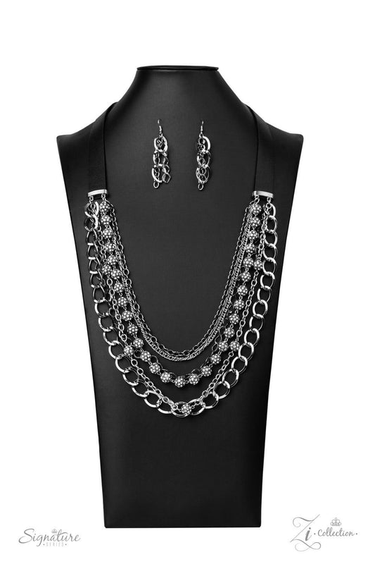 Paparazzi Accessories The Arlington 💗💗ZiCollection $25💗💗 Attached to two strips of black leather, strands of bedazzled white rhinestone encrusted silver beads drape between an exaggerated display of mismatched silver and gunmetal chains down the chest