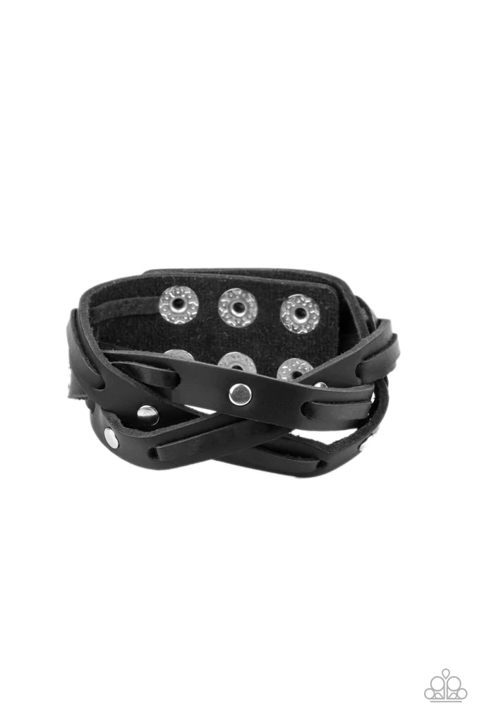 Paparazzi Accessories Rugged Roundup - Black Featuring sections of silver studs and black leather laces, black leather bands weave into a rugged braid around the wrist. Features an adjustable snap closure. Sold as one individual bracelet. Jewelry
