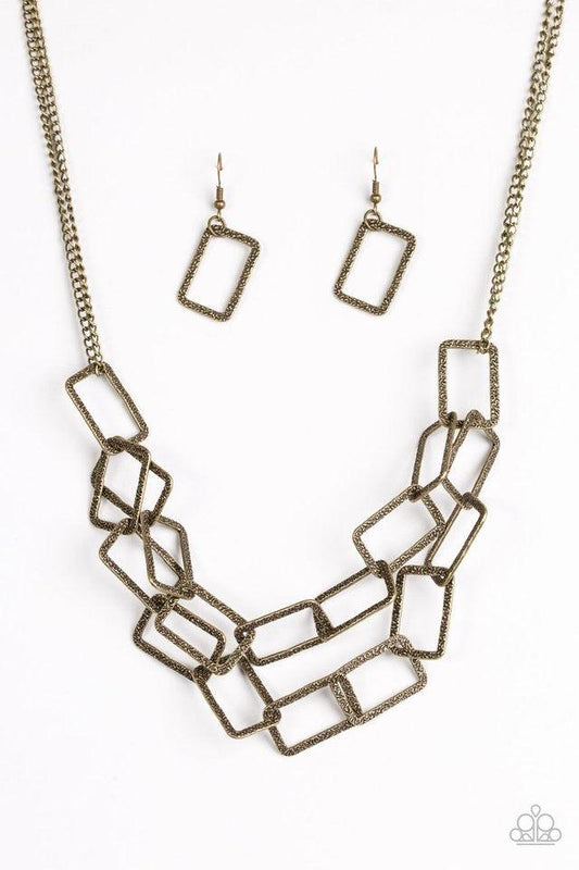 Paparazzi Accessories Seattle Scene - Brass Delicately hammered in light-catching shimmer, rows of glistening rectangular frames link below the collar for a bold industrial style. Features an adjustable clasp closure. Sold as one individual necklace. Incl