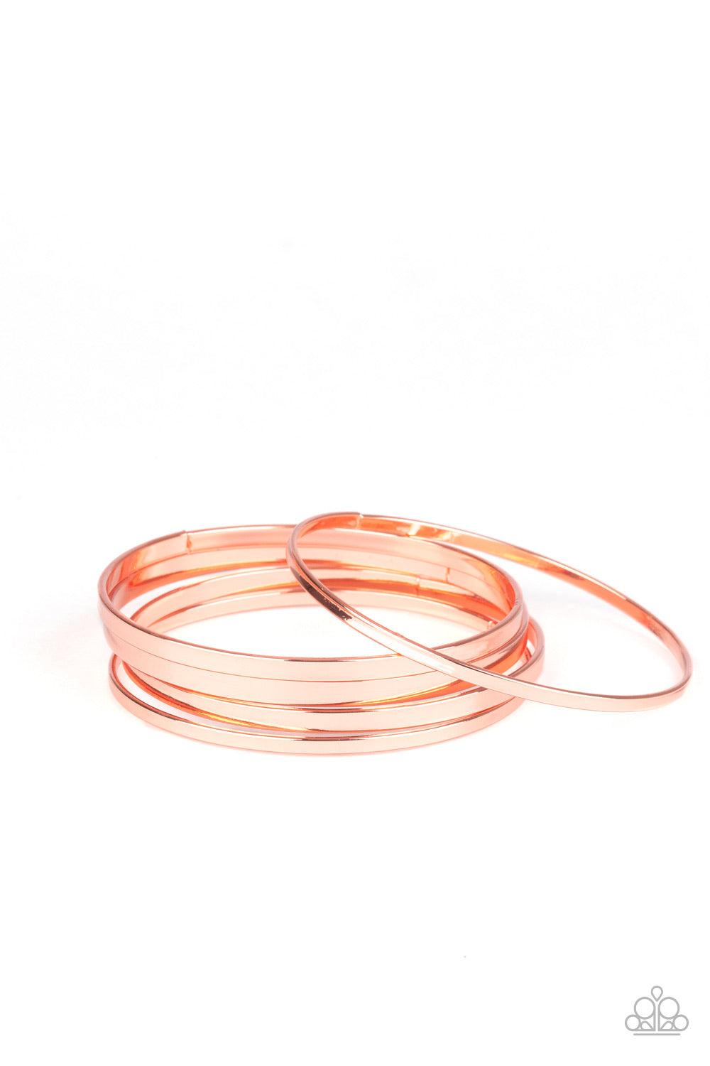 Paparazzi Accessories Ensnared - Copper A collection of flat shiny copper bangles stack along the wrist, creating an irresistible edgy shimmer. Jewelry