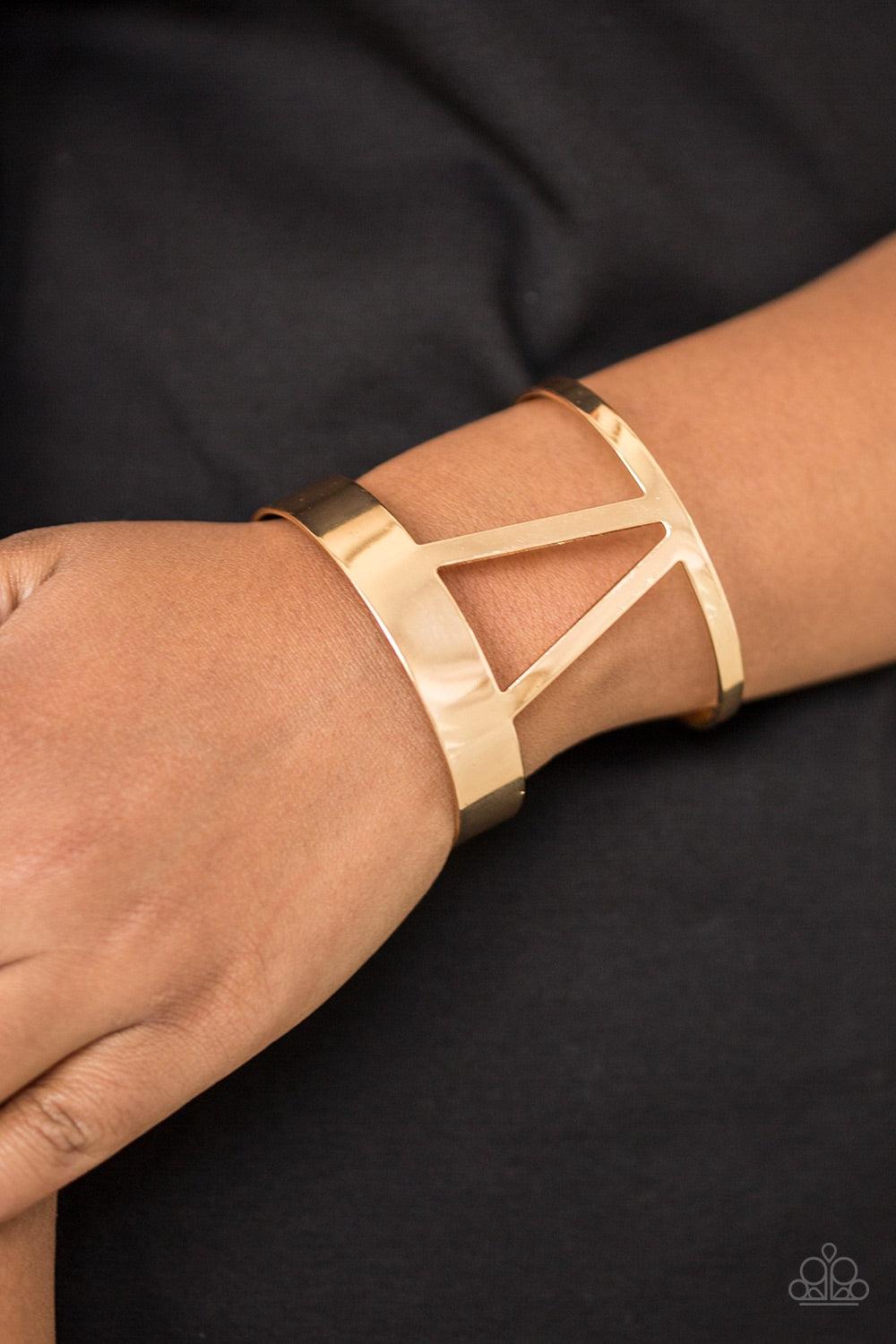 Paparazzi Accessories Rural Ruler - Gold Brushed in a high-sheen shimmer, an airy geometrical gold cuff wraps around the wrist for a tribal inspired look. Jewelry