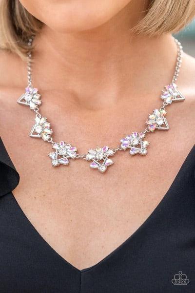 Paparazzi Accessories Extragalactic Extravagance - Multi Featuring a stellar radiance, clusters of teardrop and marquise cut iridescent rhinestones fan out from white rhinestone centers along the tops of studded and pronged triangular frames. The centermo