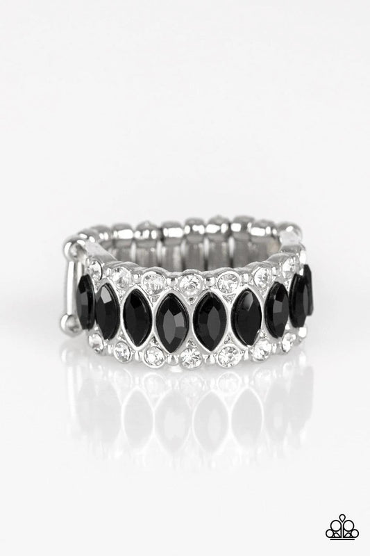 Paparazzi Accessories Radical Riches - Black Featuring regal marquise style cuts, glittery black rhinestones are encrusted down the center of a silver band radiating with glassy white rhinestones for an edgy look. Features a stretchy band for a flexible f