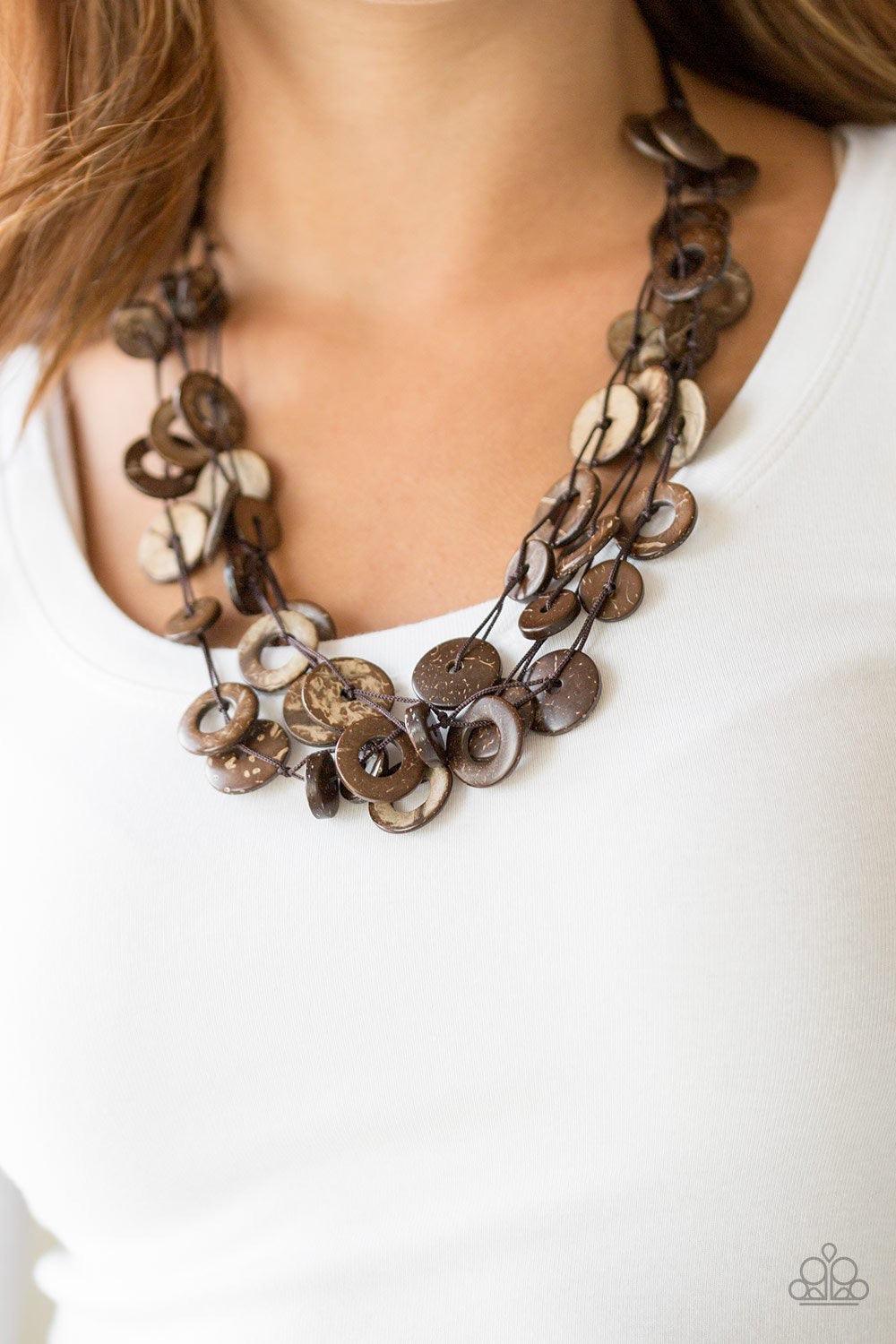 Paparazzi Accessories Wonderfully Walla Walla - Brown Shiny brown cording knots around mismatched brown wooden beads, creating vivacious layers. Features a button loop closure. Sold as one individual necklace. Includes one pair of matching earrings. Jewel