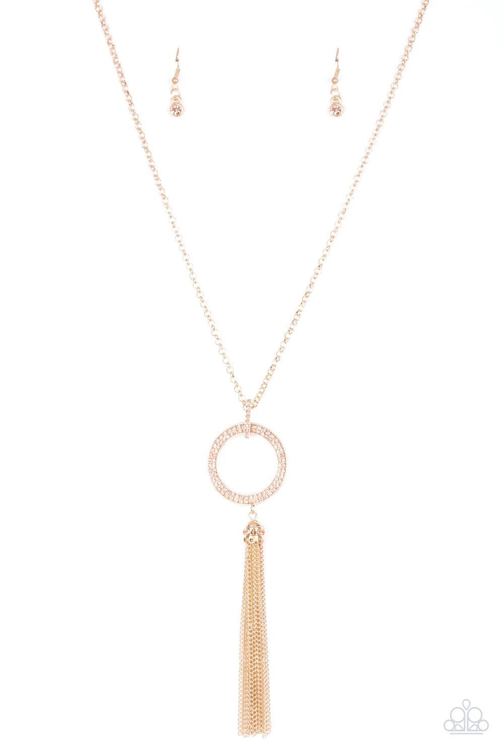 Paparazzi Accessories Straight To The Top - Gold Encrusted in dazzling peach rhinestones, a shimmery gold hoop swings from the bottom of an elegantly elongated gold chain for a refined look. A glistening gold tassel swings from the bottom of the glittery