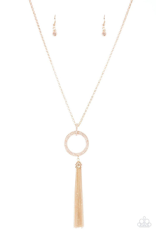 Paparazzi Accessories Straight To The Top - Gold Encrusted in dazzling peach rhinestones, a shimmery gold hoop swings from the bottom of an elegantly elongated gold chain for a refined look. A glistening gold tassel swings from the bottom of the glittery