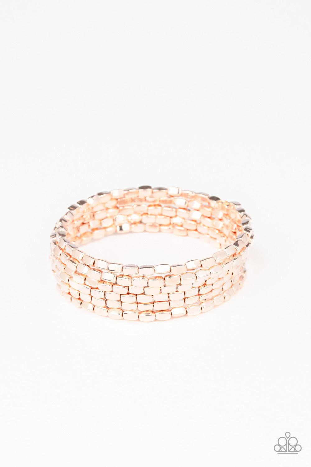 Paparazzi Accessories Stunningly Stacked - Rose Gold A glistening collection of rectangular rose gold beads are threaded along a coiled wire, creating a shimmery infinity wrap style bracelet around the wrist. Jewelry